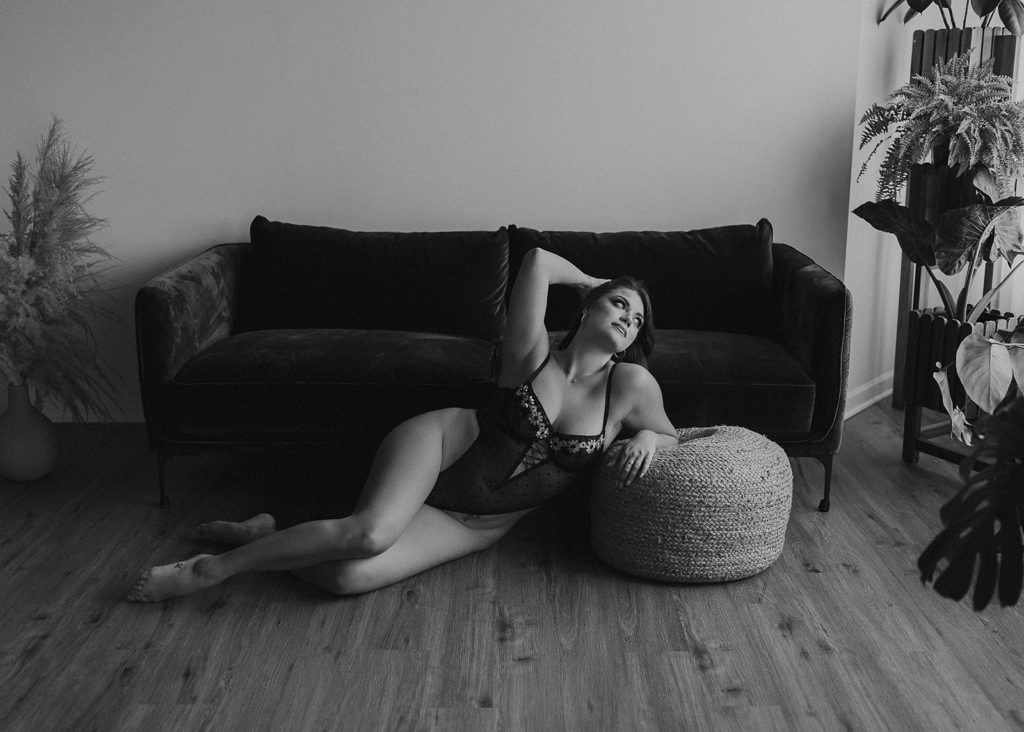 black and white image of women posing during her boudoir session in rochester ny at gallery 48 photography studio