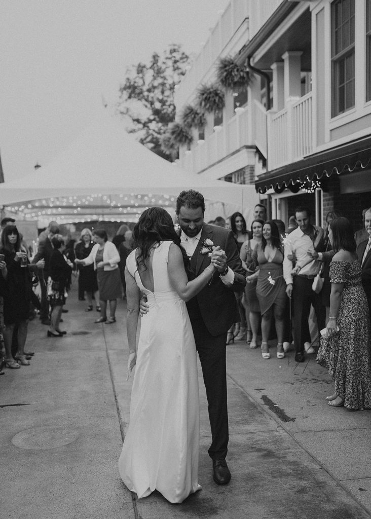 black and white photo of bride and groom sharing their first dance
