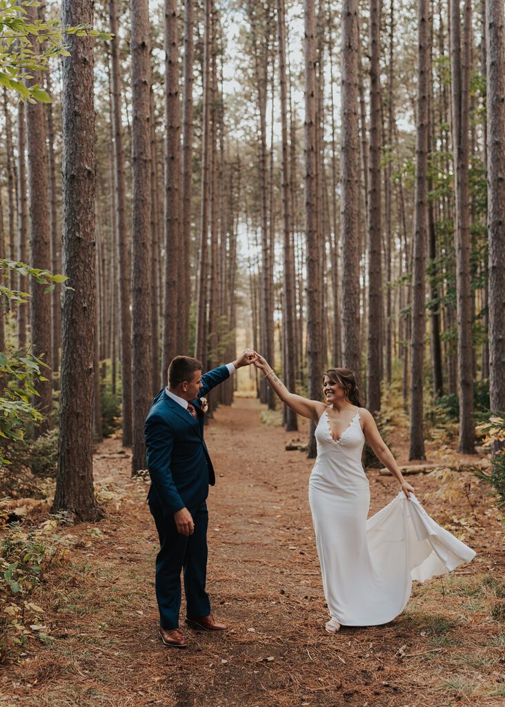 Bride and Groom dancing in the forest at cummings nature center a Rochester NY Wedding Venue