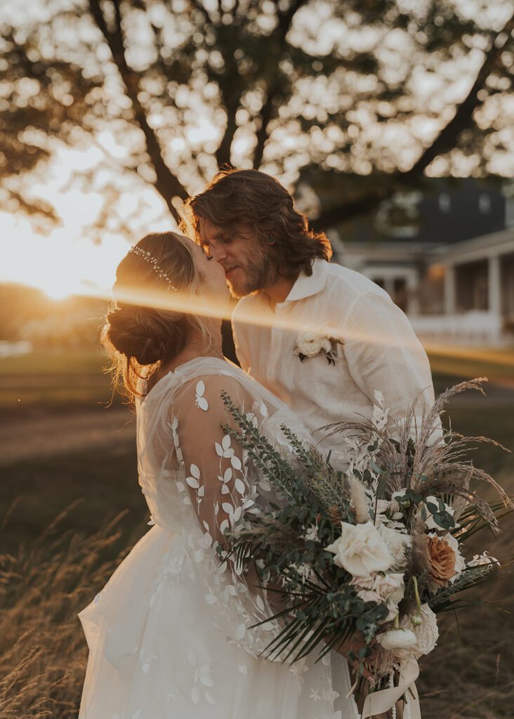 groom kissing bride during their bridal portraits 
