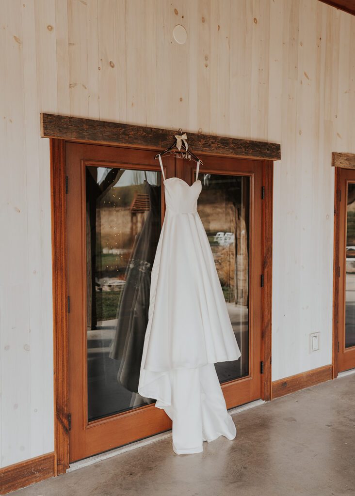 Brides gown hanging at the wedding venue in rochester ny